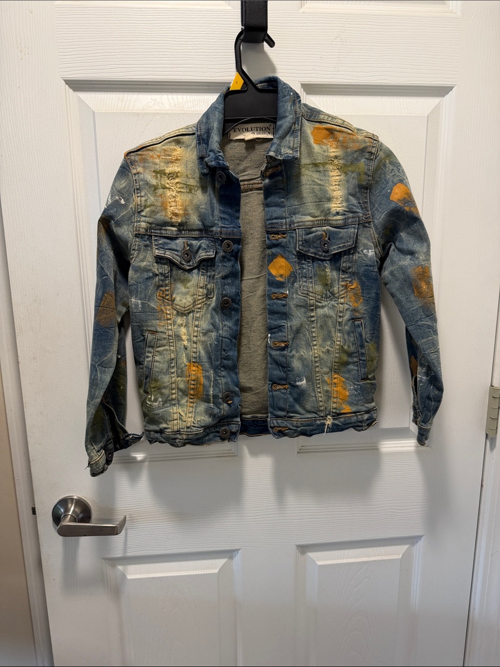 Distressed Blue Denim Jacket with Orange Paint Accents
